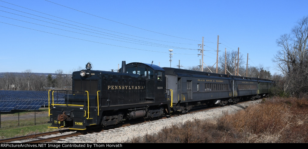 PRR 9206 leads a "Santa Express" past the solar farm